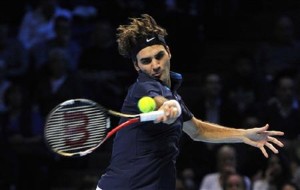 Federer of Switzerland retruns the ball during his singles tennis match against Nadal of Spain at the ATP World Tour Finals in London